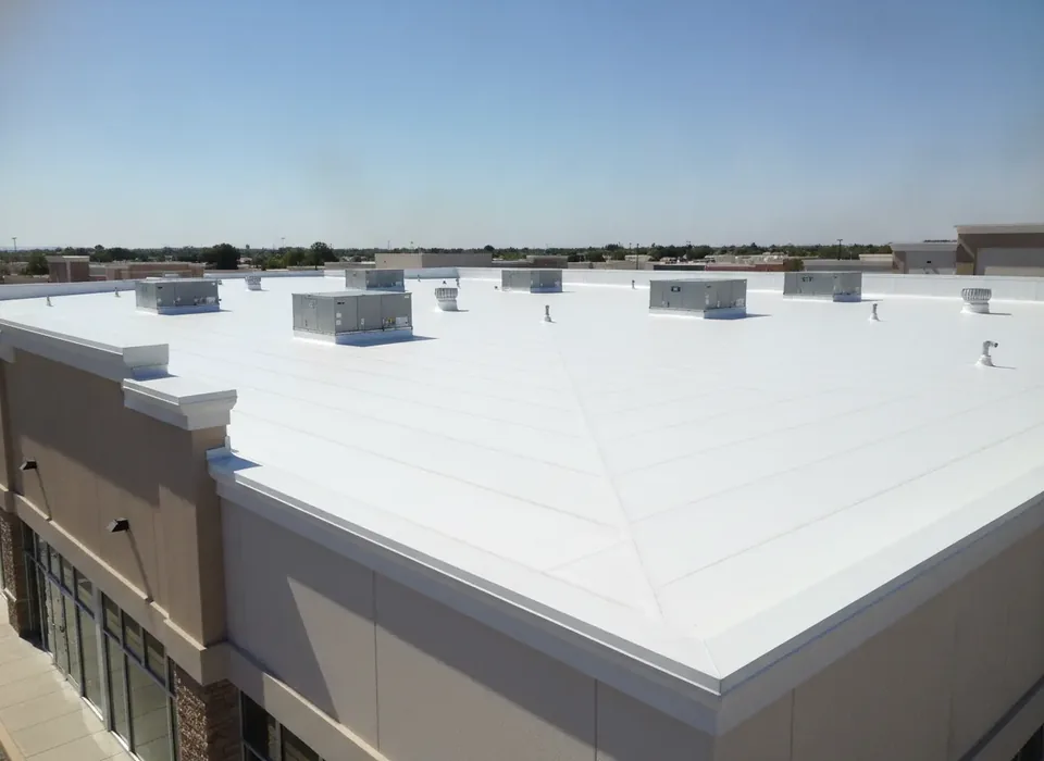 New white TPO roof on a retail strip building